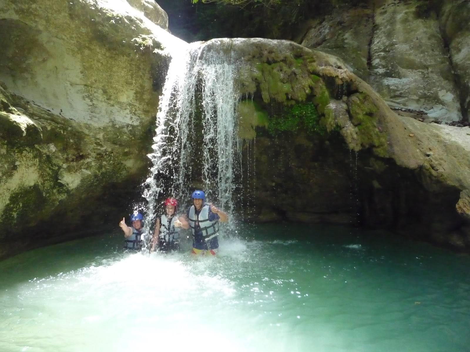 Group of people posing at the 27 Charcos de Damajagua waterfalls